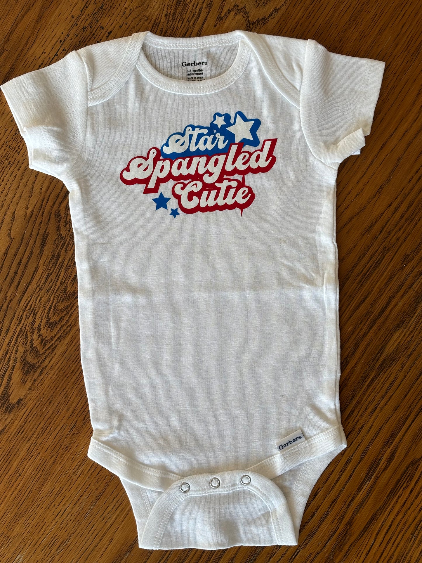Star Spangled Cutie in Cursive Patriotic Onesie